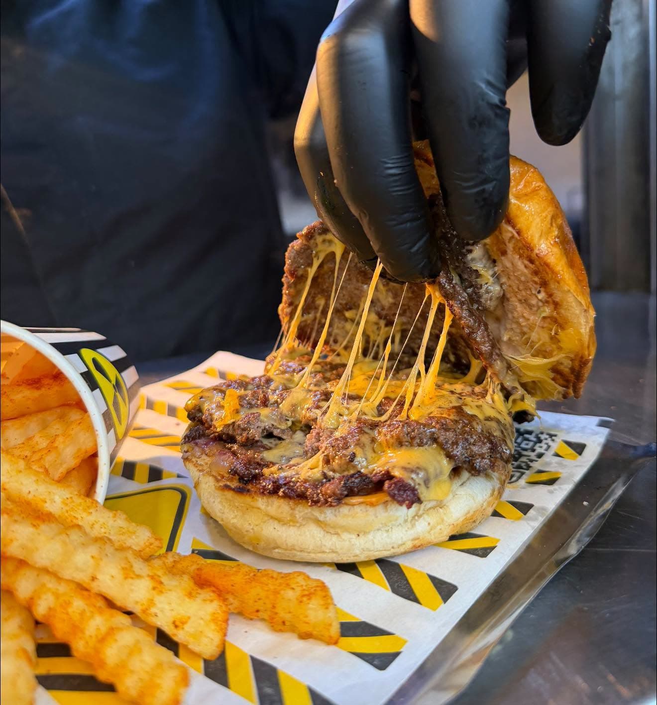 Cheese pull from a Lab Station burger